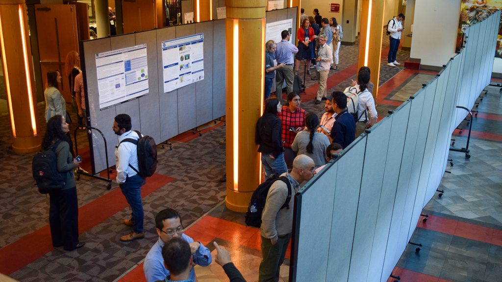 CIROH researchers discuss projects during the Science Meeting poster sessions. (Photo credit: AWI/Brock Parker)